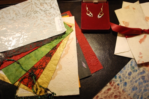 Sample papers on display for inspiration in designing your own invitation!